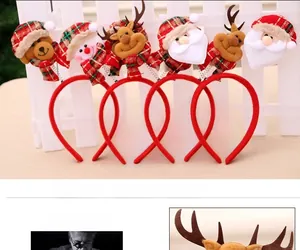 Detail view of festive Christmas headbands featuring Santa, reindeer, and snowman designs