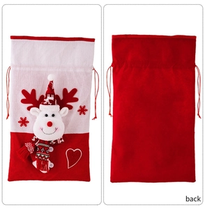 Detail of Christmas knitted gift bag with a 3D reindeer pattern and drawstring closure
