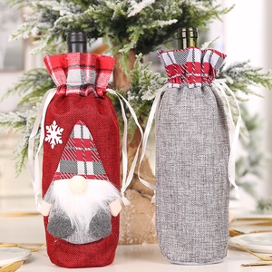 Christmas gnome wine bottle gift bags in red and grey burlap for holiday table decoration