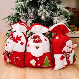 Detailed view of 3D Santa, Reindeer and Snowman knitted Christmas drawstring gift bags