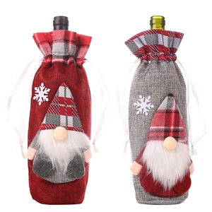 Set of two Christmas wine bottle covers with red and grey forest gnome and snowflake designs