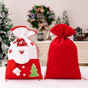 Detail of Christmas gift bags with 3D Santa plush design and knitted drawstring closure