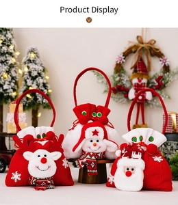 Detail of Christmas knitted gift bags with reindeer, snowman and Santa Claus characters