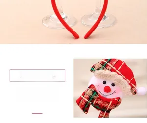 Close-up of a Christmas snowman headband with festive plaid hat and spring attachment