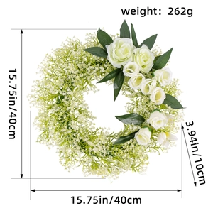 Detail view of 15.75 inch white rose wreath with baby's breath and green foliage