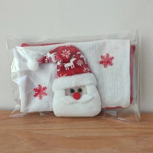 Detail of Santa Claus knitted gift bag featuring 3D motifs and snowflake embroidery