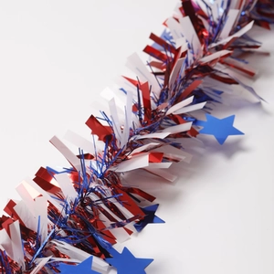 Detail of Independence Day red white and blue metallic tinsel garland with blue stars