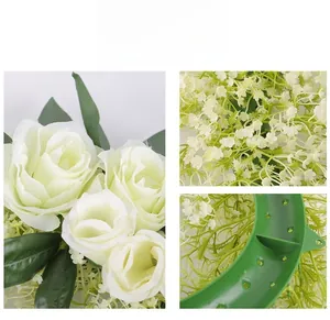 Detailed view of artificial white roses with realistic silk petals and green plastic base