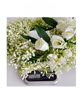 Detailed weight measurement of a realistic white rose and gypsophila floral wreath