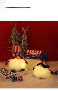Close-up of glowing Independence Day gnomes with LED lights and patriotic stars design