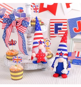 Detail of handmade patriotic gnomes with American flag patterns on a rustic tiered tray
