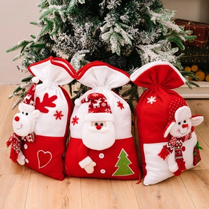 Knitted Christmas gift bags featuring 3D Santa, reindeer and snowman designs with drawstring