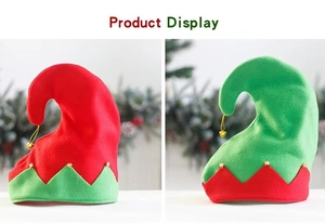 Close-up of red and green Christmas elf hats with jagged edges and golden bells