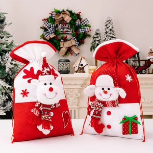 Knitted Christmas gift bags featuring festive elk and snowman characters with drawstring closure