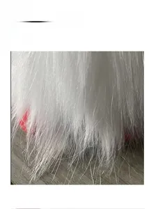 Close-up detail of soft white faux fur material on the faceless gnome plush doll