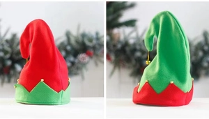 Detail of red and green velvet elf hats with scalloped edges and gold metal bells