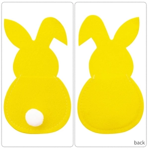 Detail of yellow rabbit felt cutlery holders showing white pom-pom tail and stitching