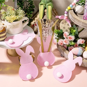 Pink felt bunny cutlery holder with white pom-pom tail for Easter table decoration set