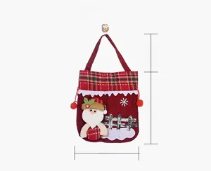 Size display of a red Christmas gift bag with Santa Claus applique measuring 24x20cm