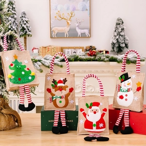 Set of four Christmas jute gift bags with 3D cartoon appliques and striped legs