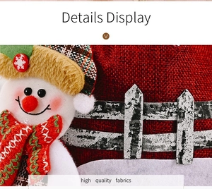 Close-up of burlap Christmas gift bag with 3D snowman detail and red plaid hat accents
