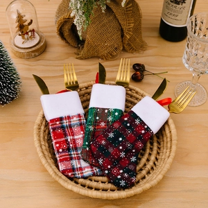 Three-pack Christmas snowflake plaid mini stocking cutlery holders on a festive table