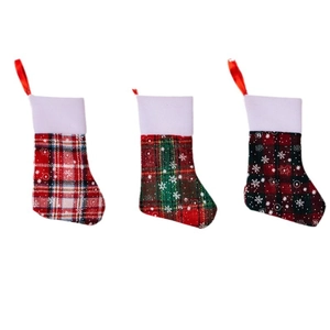Three-piece Christmas stocking set with festive plaid patterns and snowflake designs
