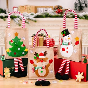 Three-piece Christmas burlap gift bags with 3D cartoon motifs and striped long hanging legs