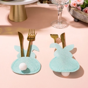 Easter bunny felt cutlery holders with white pom-pom tail and gold utensils for table decor