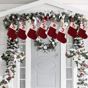 Set of 8 red knit Christmas stockings with white cuffs featuring DEER and JOY embroidery