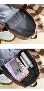 Detail view showing large capacity and internal compartments of the brown PU leather backpack