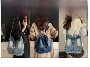 Detail der Vintage-Jeans-Einkaufstasche mit dekorativen Reißverschlüssen und Metallnieten