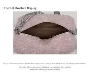 Detail view showing large internal compartment and brown lining of the pink plush handbag