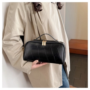 Chic black crocodile embossed travel storage bag with gold hardware and dual zippers