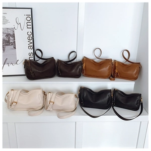 Minimalist leather shoulder bags displayed in various colors and two different sizes