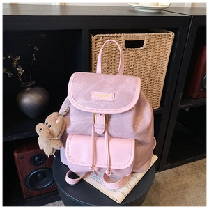 Pink vintage leather backpack for women with front pocket and plush bear charm