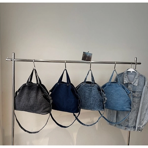 Showcase of four denim tote bags in varied washes with detachable shoulder straps