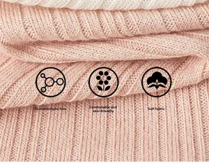 Close-up of soft pink ribbed knit fabric with skin-friendly and breathable texture