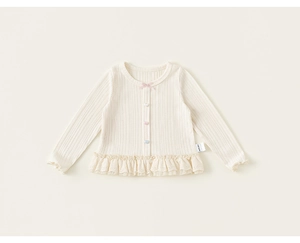 Detail of baby girl cardigan with heart buttons and delicate embroidered lace hem