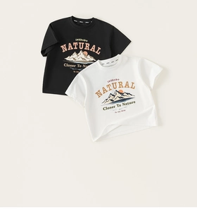 Detailed flat lay of cotton T-shirts with outdoor mountain prints and letter graphics