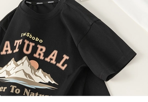 Close-up of boys black crewneck cotton t-shirt with outdoor mountain letter print