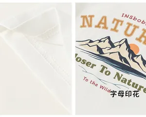 Detail of white cotton T-shirt featuring nature-themed print and wide cuff stitching