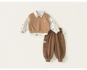 Flat lay of boy's 3-piece set with bear print shirt, knit vest, and cargo pants