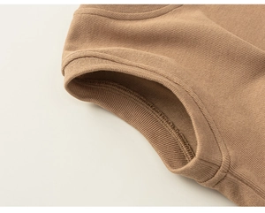 Detail of camel knitted sweater collar and ribbed texture with neat stitching craft