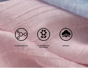 Detailed close-up of soft pink and blue cotton gauze fabric with crinkle texture details