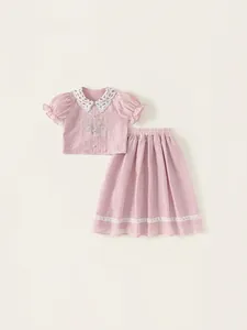 Pink girl's two-piece set featuring lace collar floral embroidery shirt and matching skirt