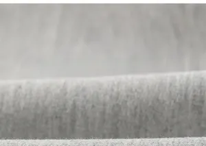 Close-up of soft grey knitted fabric texture with a warm brushed fleece finish