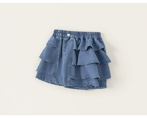 Detail view of girls' light blue tiered denim skirt with ruffled layers and elastic waist