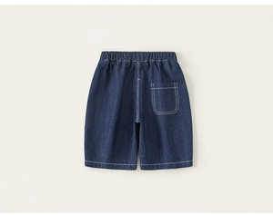 Detail view of dark blue kids denim shorts with elastic waist and white contrast stitching