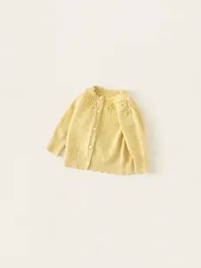 Girls' bright yellow knit cardigan with openwork bow patterns and scalloped neckline